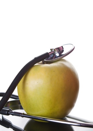 Stethoscope and Apple over white backgroundの写真素材