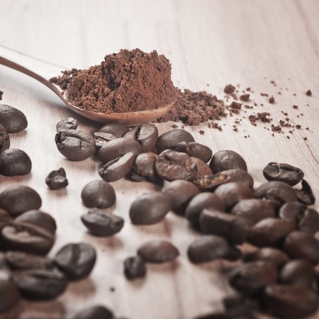 Coffee beans and cocoa in spoonの写真素材