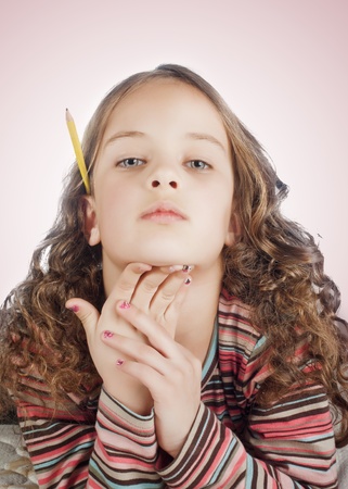  little girl with long hair posing over white backgroundの写真素材