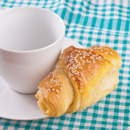 close up of empty coffee cup and croissantsの写真素材