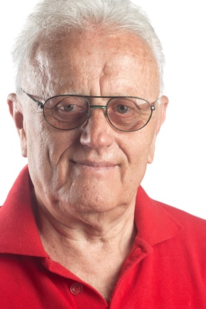 Studio portrait of smiling senior man wearing glasses.の写真素材