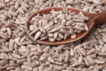 Close up of Sunflower seeds in wooden spoonの写真素材