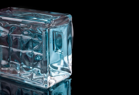 Beautifully and elegantly lit perfume bottle on blackの写真素材