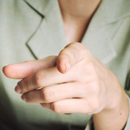 Hand indicating at you. Selective focus.の写真素材