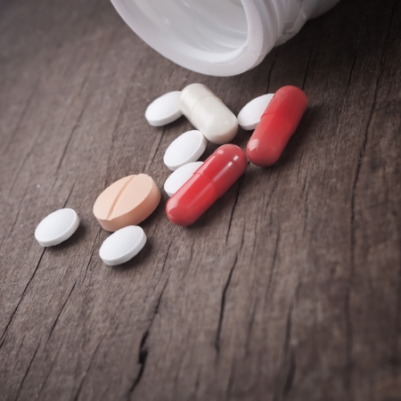 Medical pill on wooden table.の写真素材