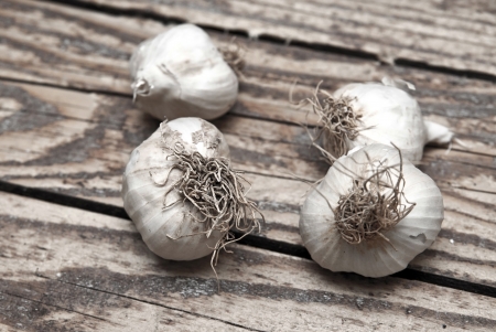 close up of Garlics on old woodの写真素材