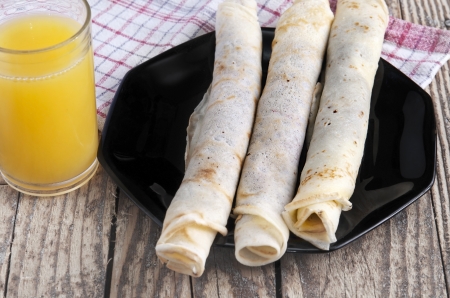 French crepes filled with dulce de leche (caramel fudge). の写真素材