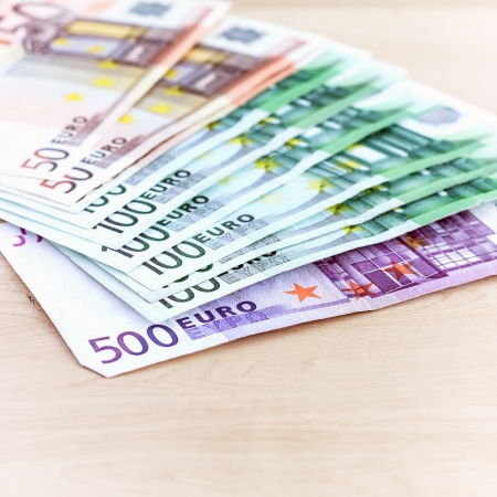 Close-up of Euro banknotes on wooden tableの写真素材