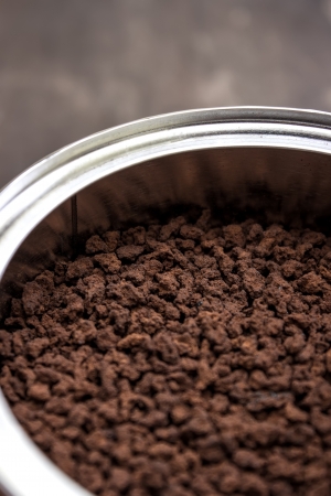 Fresh ground coffee in can,close upの写真素材