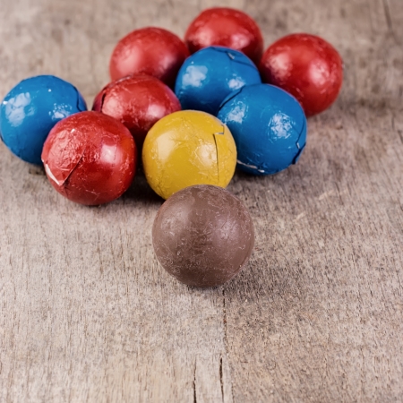 Dark brown Chocolate balls on wooden tableの写真素材