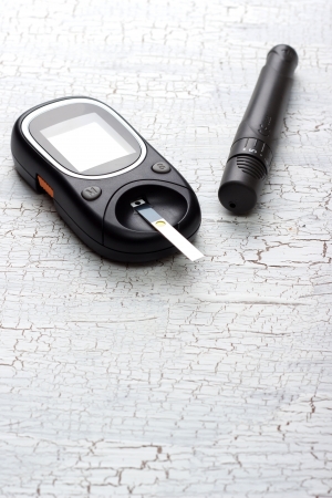 device for measuring blood sugar on tableの写真素材