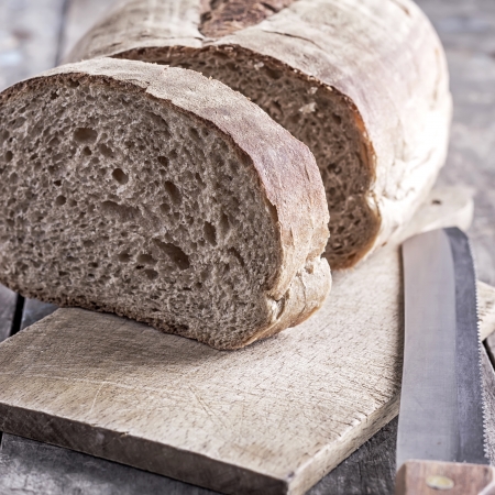 homemade bread and bread knife on table