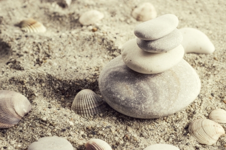 Balance  stones in sand ,retro close up photoの写真素材