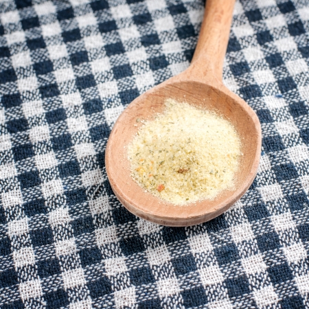 spice in a wooden spoon, close up photoの写真素材