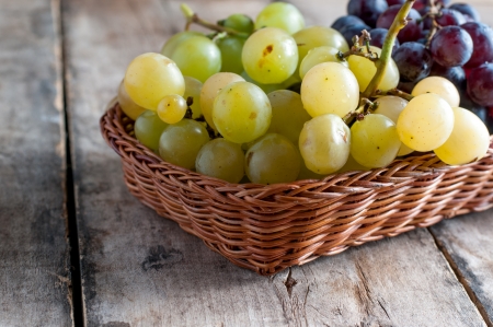 Grapes on a old wooden table.Close up photoの写真素材