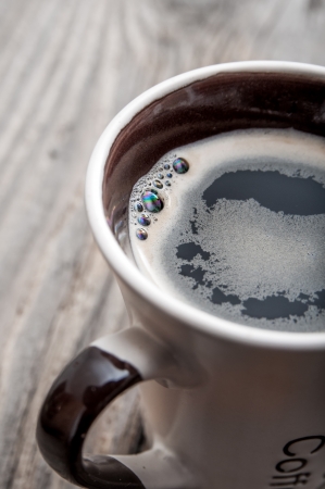 coffee cup on the wooden table, close upの写真素材