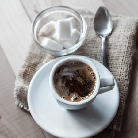 Hot coffee on table, natural light の写真素材