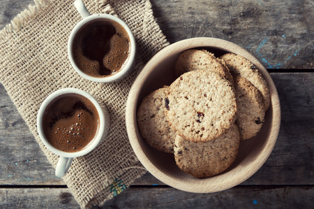 Two cups of coffe with cookies on tableの写真素材