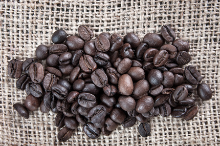 Close up of coffee beans on cloth sackの写真素材