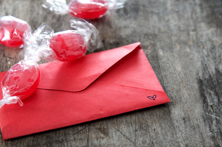  Red envelope and candy  on wooden backgroundの写真素材
