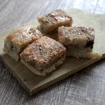 Slices of apple pie on a wooden board, close upの写真素材
