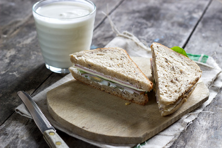 sandwich on wooden cutting board, natural lightの写真素材