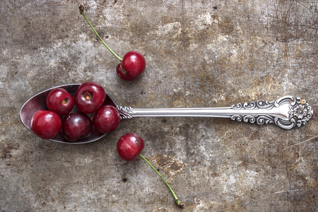 Top view of a cherries on a rustic backgroundの写真素材