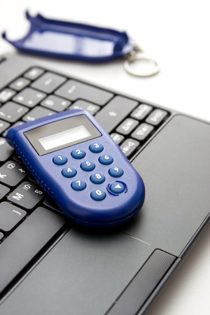 One-time password ,e banking. Close up of token on table