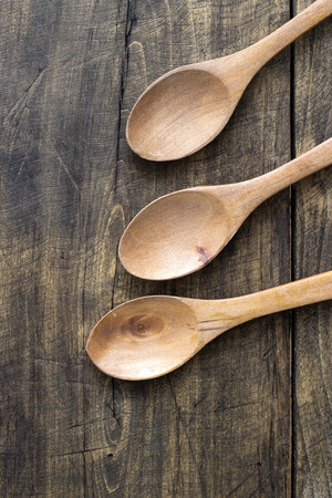 wooden spoons on wooden table, from aboveの写真素材