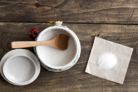 white sugar in  bowl  on wooden table, from aboveの写真素材