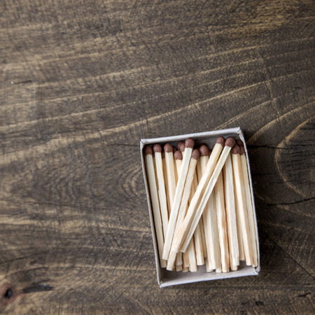 safety matches on wooden table, from aboveの写真素材