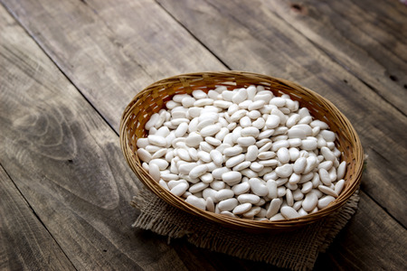 wicker basket full of beans on table, food closeupの写真素材