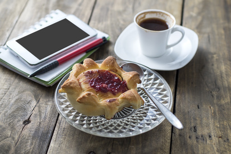 homemade puff pastry filled with strawberry jam and coffee