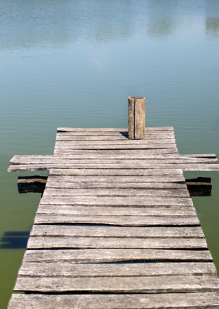 Old wooden pier on the lake, natural lightの写真素材