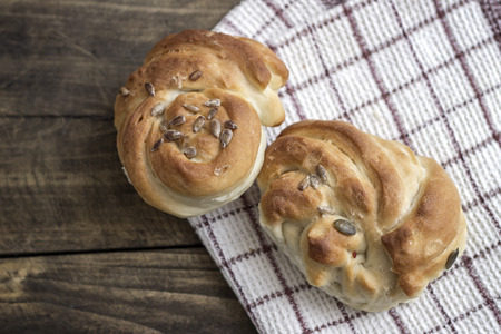 Fresh homemade bread on wooden table, from above