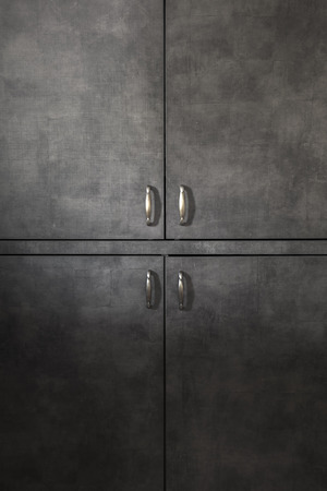 Wooden doors background with  handles, natural lightの写真素材