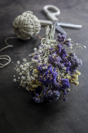 Bouquet of dried flowers on wooden table, close upの写真素材