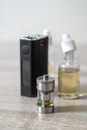 E-cigarette or vaping device on wooden surface, close upの写真素材