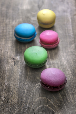 Colorful macaroons  on wooden background, close upの写真素材