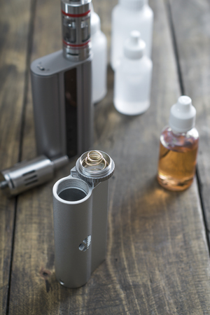 E-cigarettes with lots of different re-fill bottles, close upの写真素材