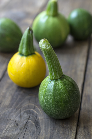 Fresh zucchini  on wooden table, close upの写真素材