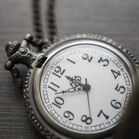 Old pocket watch  in close up. Vintage still life.