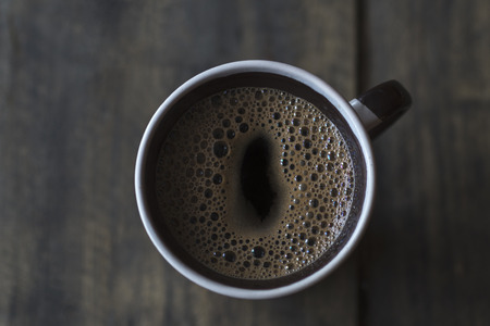Cup of Coffee on Wooden Table, from above