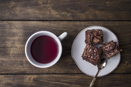 Chocolate Cake and cup of tea  on tableの写真素材