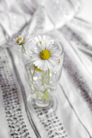 Bouquet of daisies on wooden table, close upの写真素材