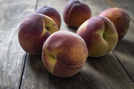 Peaches on wooden table, close upの写真素材