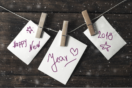 New Year card with snow on wooden backgroundの写真素材