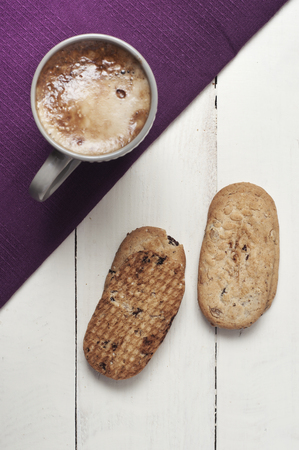 Coffee with cookies on white wooden table from aboveの写真素材