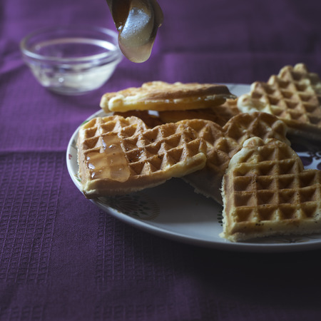 Close up photo of homemade waffles with honey の写真素材