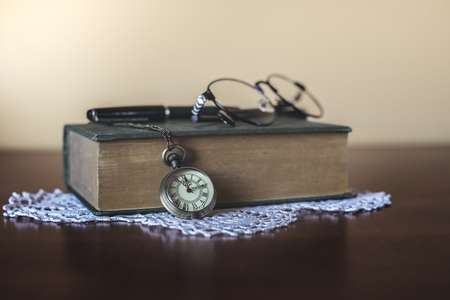 Vintage pocket watch on the tableの写真素材